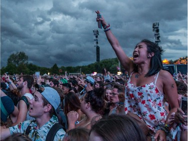 Music fans enjoy the performance by Of Monsters and Men on day one of the 2015 edition of the Osheaga Music Festival at Jean-Drapeau Park in Montreal on Friday, July 31, 2015.