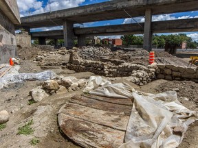 Quebec archaeologists are searching an area about the size of a football field at the corner of St-Jacques and St-Rémi Sts. in Montreal, on Friday, July 31, 2015.