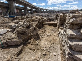 Quebec archaeologists are searching an area about the size of a football field at the corner of St-Jacques and St-Rémi Sts. in Montreal, on Friday, July 31, 2015.