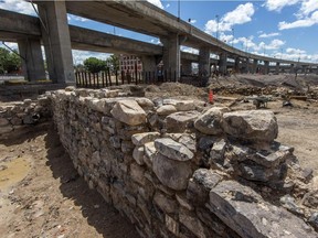 Quebec archaeologists are searching an area about the size of a football field at the corner of St-Jacques and St-Rémi Sts. in Montreal, on Friday, July 31, 2015.