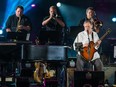 Bob Walsh, right, performs during a tribute concert for blues legend B. B. King featuring several artists for the closing show for the Montreal International Jazz Festival at Place des Arts in Montreal on Sunday, July 5, 2015.