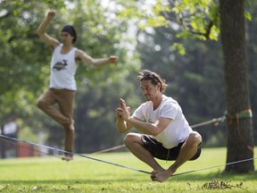 Maxime Pelletier (right) and Julien Desforges in Jarry Park. "On the slackline, you have to stay present," says Desforges, who founded Slackline Montreal in 2006.