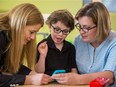 Neurologist Dr. Geneviève Bernard, left, eight year-old Xavier and his mother Émilie Lapointe, right, pose for a photograph at the Montreal Children's Hospital at the MUHC Glen site on Wednesday, July 8, 2015. Xavier suffers from the rare genetic disorder 4H leukodystrophy.