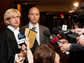 Crown prosecutor Lyne Décarie, left, speaks with the media in June 2015.