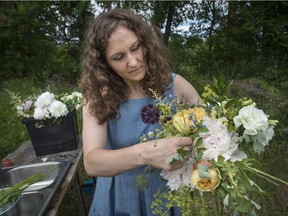 Caroline Boyce works on putting together a bridal bouquet at her Hemmingford farm on Thursday, June 25, 2015.