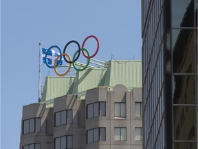 The Olympic rings sit atop the new home of Olympic House at 500 René Lévesque Blvd. W.,  (Peter McCabe / MONTREAL GAZETTE)
