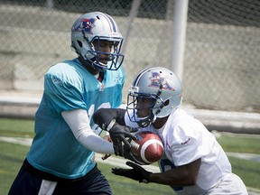 All indications suggest the Als will start Rakeem Cato (left, handing the ball of to Stefan Logan during preseason) as their quarterback on Friday against the Stampeders.