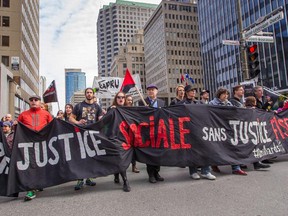 Protesters take part in a May Day demonstration against the Quebec government's austerity measures in Montreal on Friday, May 1, 2015.
