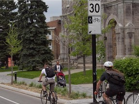 Cyclists makes their way East on Laurier near St. Denis.