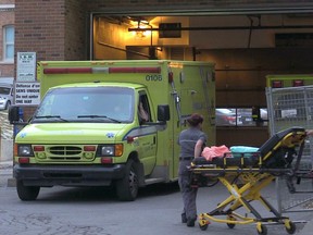 An ambulance in an ambulance bay.