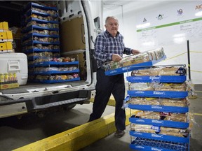 Brian Cadoret loads his van with bread at Moisson Montreal in Montreal, Monday September 8, 2014.