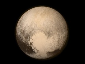 IN SPACE - JULY 14:  In this handout provided by the National Aeronautics and Space Administration (NASA), Pluto nearly fills the frame in this image from the Long Range Reconnaissance Imager (LORRI) aboard NASA's New Horizons spacecraft, taken on July 13, 2015, when the spacecraft was 476,000 miles (768,000 kilometers) from the surface. This is the last and most detailed image sent to Earth before the spacecraft's closest approach to Pluto. New Horizons spacecraft is nearing its July 14 fly-by when it will close to a distance of about 7,800 miles (12,500 kilometers). The 1,050-pound piano sized probe, which was launched January 19, 2006 aboard an Atlas V rocket from Cape Canaveral, Florida, is traveling 30,800 mph as it approaches.