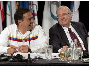 Former prime minister Paul Martin has a laugh with National Chief Perry Bellegarde, left, before addressing the Assembly of First Nations congress, Thursday, July 9, 2015 in Montreal.