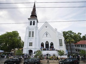 People line up to attend the wake of Sen. Clementa Pinckney, one of the nine killed in a shooting, at Emanuel AME Church, Thursday, June 25, 2015, in Charleston, S.C.