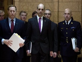 Justice Minister Peter MacKay (left), Public Safety and Emergency Preparedness Minister Steven Blaney, CSIS director Michel Coulombe and RCMP Commissioner Bob Paulson arrive at the Commons public safety committee hearing witnesses on Bill C-51, Anti-terrorism Act on Parliament Hill in Ottawa, Tuesday March 10, 2015.