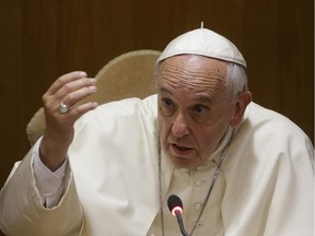 Pope Francis delivers a speech in the Synod Hall.