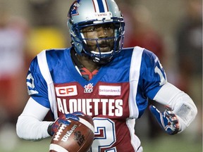 Montreal Alouettes quarterback Rakeem Cato (12) looks for an open man during third quarter CFL action against the Calgary Stampeders Friday, July 3, 2015 in Montreal.