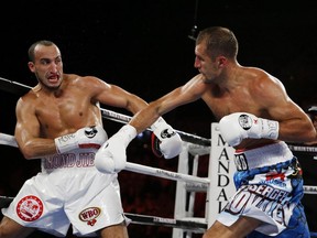 Sergey Kovalev, right, follows through on right to Nadjib Mohammedi during their light heavyweight title boxing gout Saturday, July 25, 2015, in Las Vegas.