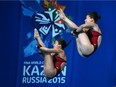 Divers Maeghan Benfeito and Roseline Filion compete in the Women's 10m platform synchronised final diving event at the 2015 FINA World Championships in Kazan on July 27, 2015.