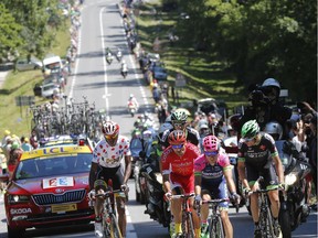 Cyclists climb during the seventh stage of the Tour de France on July 10, 2015.