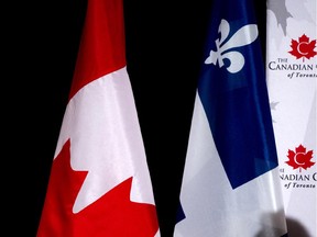 The Canadian and Quebec flags.