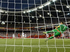 Carli Lloyd of the United States scores the opening goal from a penalty in FIFA Women's World Cup semifinal at Montreal's Olympic Stadium on June 30, 2015. The U.S. won 2-0