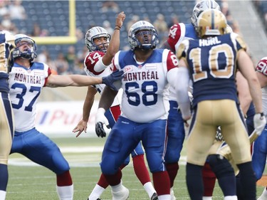 Montreal Alouettes' Boris Bede (14) watches his field goal go through the pipes against the Winnipeg Blue Bombers during the first half of CFL action in Winnipeg Friday, July 10, 2015.