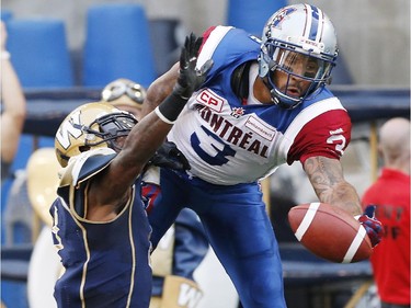 Winnipeg Blue Bombers' Demond Washington (7) defends as Montreal Alouettes' Cody Hoffman (3) can't haul in this pass in the Bombers' end zone during the first half of CFL action in Winnipeg Friday, July 10, 2015.