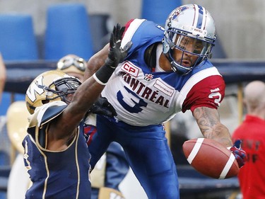 Winnipeg Blue Bombers' Demond Washington (7) defends as Montreal Alouettes' Cody Hoffman (3) can't haul in this pass in the Bombers' end zone during the first half of CFL action in Winnipeg Friday, July 10, 2015.