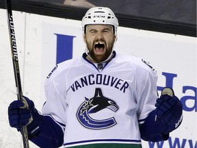 Zack Kassian celebrates after scoring goal for the Canucks against the Boston Bruins during NHL game in Boston on Feb. 24, 2015.