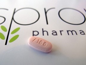 FILE - In this June 22, 2015, photo, a tablet of flibanserin sits on a brochure for Sprout Pharmaceuticals in the company's Raleigh, N.C., headquarters. The Food and Drug Administration on Tuesday, Aug. 18, 2015, approved the first prescription drug designed to boost sexual desire in women, a milestone long sought by a pharmaceutical industry eager to replicate the blockbuster success of impotence drugs for men. (AP Photo/Allen G. Breed)