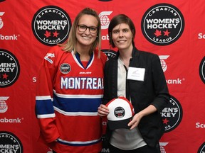Montreal Stars forward Marie-Philip Poulin (left), the team's first choice in the Aug. 23, 2015 Canadian Women's Hockey League draft in Toronto, poses with Stars general manager Meg Hewings.