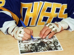 The foiled fists of the Hanson Brothers are a huge part of their lore from the 1977 cult classic film Slap Shot.