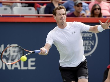 Andy Murray, of Great Britain, hits a return to Gilles Muller, of Luxembourg, during round of 16 tennis action at the Rogers Cup in Montreal on Thursday, August 13, 2015.
