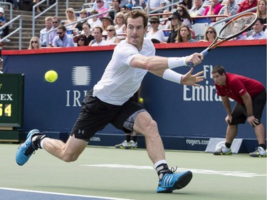 Andy Murray, of Great Britain, lunges for the ball to return to Gilles Muller, of Luxembourg, during round of sixteen play at the Rogers Cup tennis tournament on Thursday, August 13, 2015 in Montreal. Murray won 6-3, 6-2.