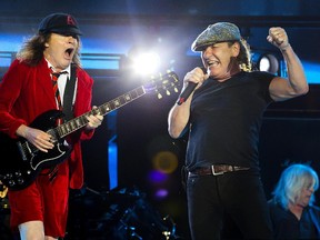 AC/DC's Angus Young, left, and Brian Johnson perform during their Rock Or Bust World Tour at Gillette Stadium in Foxborough, Mass., on Aug. 22, 2015. They're at the Big O on Monday, Aug. 31.