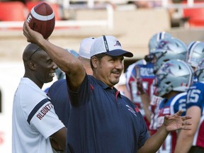 Montreal Alouette quarterback coach Anthony Calvillo loosens up before the game against the Calgary Stampeders on July 3, 2015 in Montreal. Calvillo was named quarterbacks coach on Saturday as general manager Jim Popp tweaked his staff a day after stepping in for fired head coach Tom Higgins.