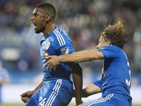 Montreal Impact's Anthony Jackson-Hamel, left, celebrates with teammate Marco Donadel after scoring against the Vancouver Whitecaps during second half Amway Canadian Championship final first leg soccer action in Montreal, Wednesday, August 12, 2015.