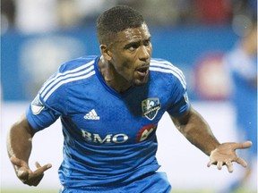 The Impact's Anthony Jackson-Hamel celebrates after scoring against the Vancouver Whitecaps during Amway Canadian Championship first-leg game at Montreal's Saputo Stadium on Aug. 12, 2015.