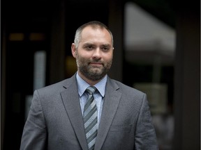 Benjamin Perrin, former legal adviser for the Prime Minister's Office, leaves the courthouse in Ottawa following his second day of testimony at the trial of former Conservative Senator Mike Duffy on Friday, August 21, 2015. Duffy is facing 31 charges of fraud, breach of trust and bribery.