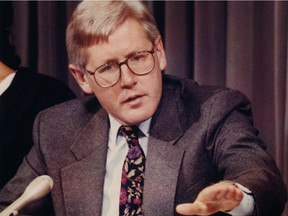 Bob Rae gestures during a news conference.