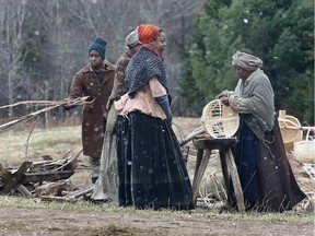 Background actors are seen during filming of "The Book Of Negroes" in Cole Harbour, N.S., on Monday, April 28, 2014. One of the most devastating ways that Canada has denied its own history of anti-black racism is through a narrative of benevolence that overshadows the human agency of black struggle, Rachel Zellars writes.