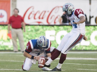 Montreal Alouettes' Boris Bede, right, kicks a field goal during first half CFL football action against the Edmonton Eskimos in Montreal on Thursday, August 13, 2015.