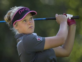 Brooke Henderson of Smiths Falls, Ont., tees off on the 18th hole at the Canadian Pacific Women's Open LPGA golf tournament at the Vancouver Golf Club in Coquitlam, B.C., on Saturday, August 22, 2015.