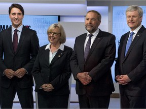 Party leaders Justin Trudeau, Liberal Party; Elizabeth May, Green Party; Thomas Mulcair, NDP; and Stephen Harper, Conservative Party, stand for a photograph prior to the first  leaders' debate August 6, 2015 in Toronto.
