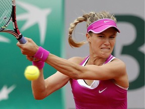 Westmount's Eugenie Bouchard returns ball to  France's Kristina Mladenovic during first- round match at the French Open on May 26, 2015 in Paris. Mladenovic won 6-4, 6-4.