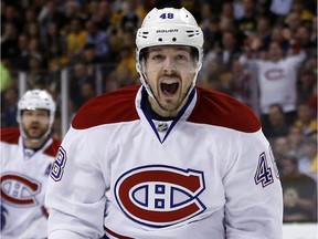 Montreal Canadiens center Daniel Briere (48) celebrates Dale Weise's goal against the Boston Bruins during the first period in Game 7 of an NHL hockey second-round playoff series in Boston, Wednesday, May 14, 2014.