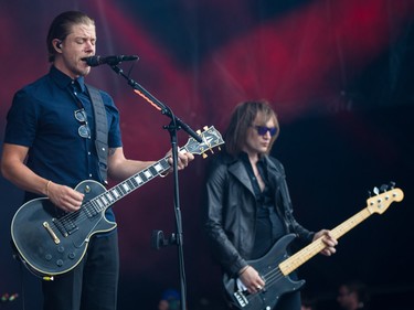 Paul Banks, left, of the band Interpol performs on the second day of the 2015 edition of the Osheaga music festival at Jean-Drapeau park in Montreal on Saturday, August 1, 2015.