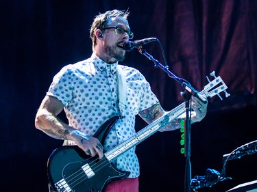 Scott Shriner of the rock band Weezer performs on the second day of the 2015 edition of the Osheaga music festival at Jean-Drapeau park in Montreal on Saturday, August 1, 2015.