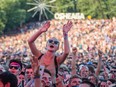 A music fan enjoys the performance by Edward Sharpe and the Magnetic Zeros at the 2015 edition of the Osheaga music festival in Montreal.